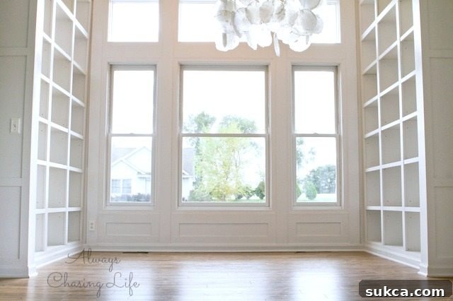 Stunning built-in library bookshelves with elegant white finish