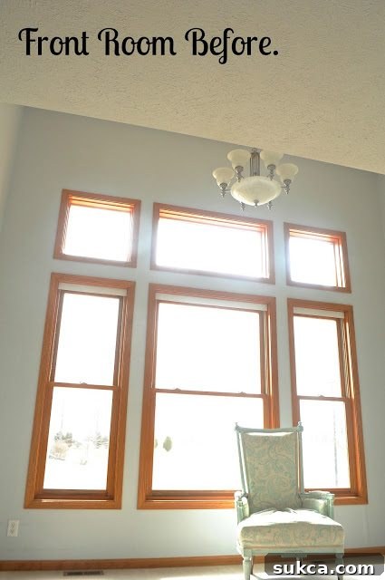 Bare room before built-in bookshelves and window trim installation