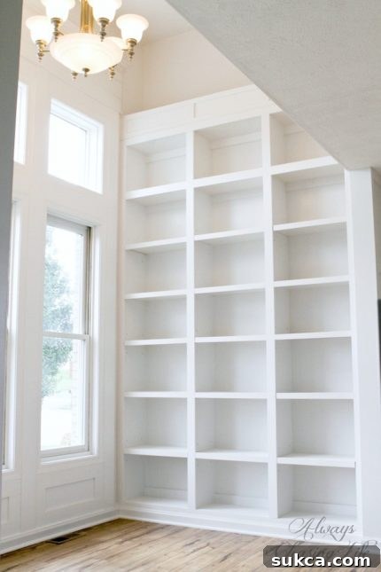 Custom DIY library bookshelves with intricate detailing