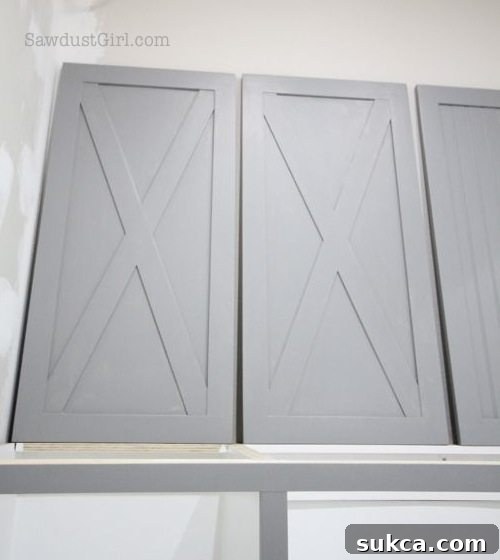 Sherwin Williams Summit Grey Cabinet Doors Close-up of the painted laundry room cabinet doors, highlighting the smooth satin finish and elegant Summit Grey color.