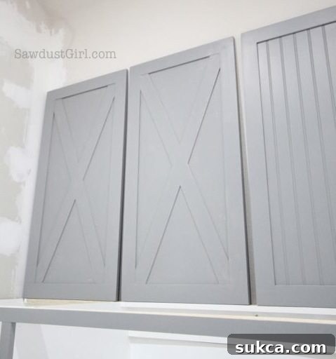 Custom Painted Cabinet Doors for Laundry Room Another perspective of the painted laundry room cabinet doors, emphasizing the quality finish and the two distinct design options.