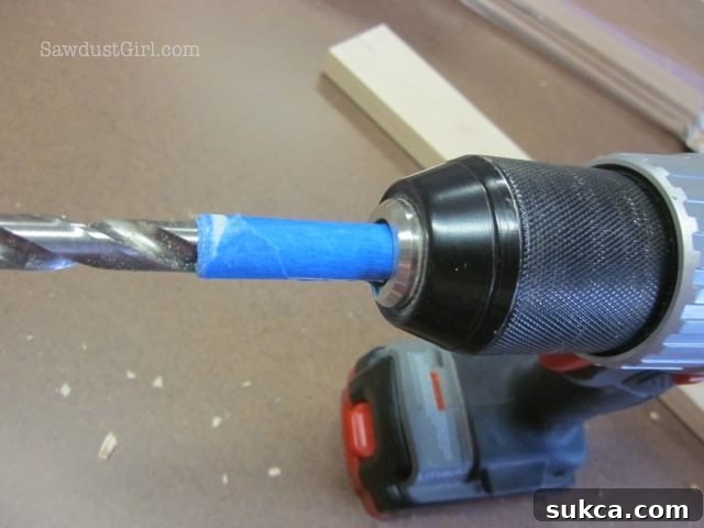 Marking drill bit depth with painter's tape for consistent mortises