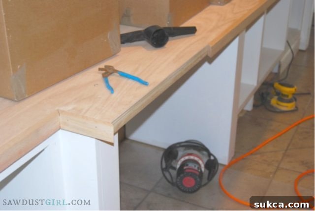 Adding the oak facing for a finished look Installing the oak 1x2 facing edge on the newly installed countertop