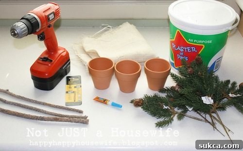 Essential Topiary Craft Supplies Close-up of crafting supplies laid out, including a drill, plaster, pots, burlap, sticks, glue, and faux pine branches for a DIY topiary project.