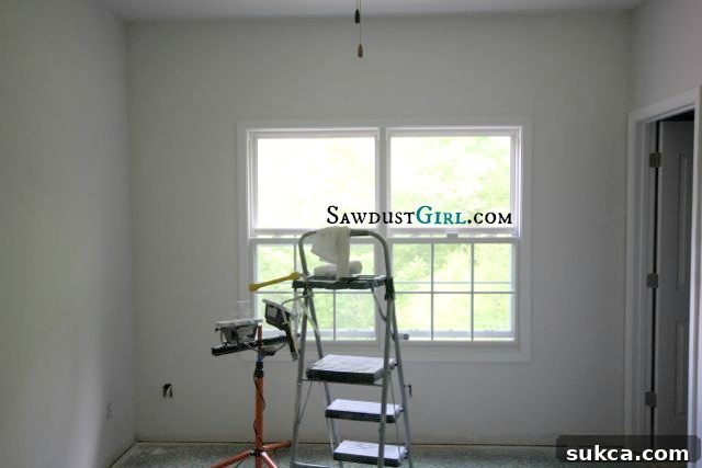 Before shot of an office window with existing standard trim, illustrating the subtle details that will be upgraded to a more substantial and custom design.