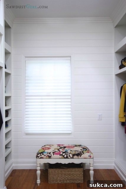 Master closet plank wall, showcasing the successful phase of home renovation Completed plank wall in a well-lit master closet, ready for future design additions