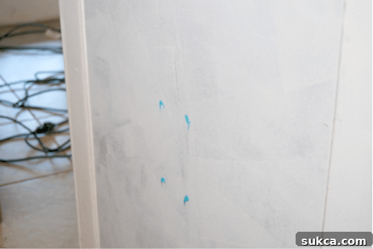 Cara applying toothpaste to an electrical outlet