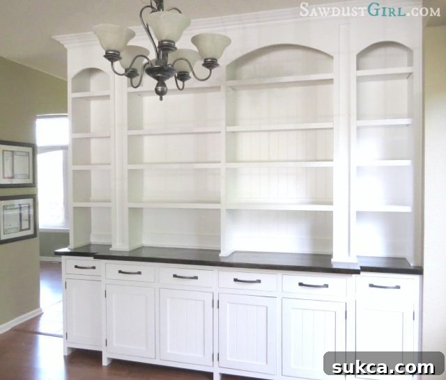 Detail shot of the custom built-in buffet showing cabinet doors, drawers, and expert joinery