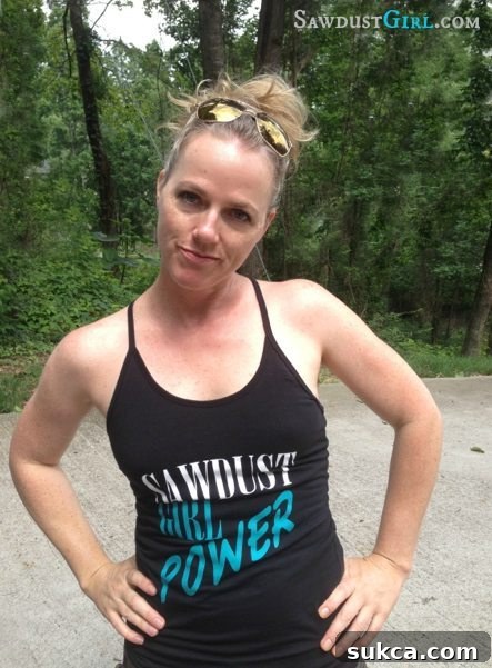 A Sawdust Girl Power design on a t-shirt, emphasizing strength and DIY spirit.