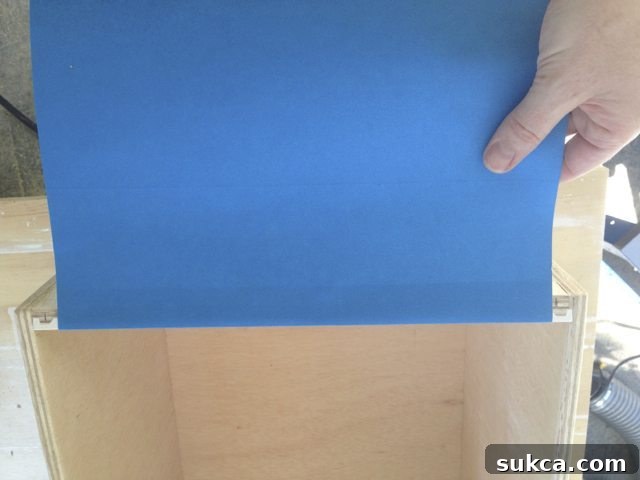 Markings on the drawer box indicating placement for the hanging file folder bars