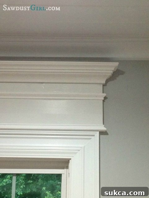 DIY decorative cross header showing wood trim