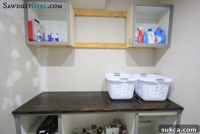 Wood countertop sink insert to extend countertop space in laundry room.