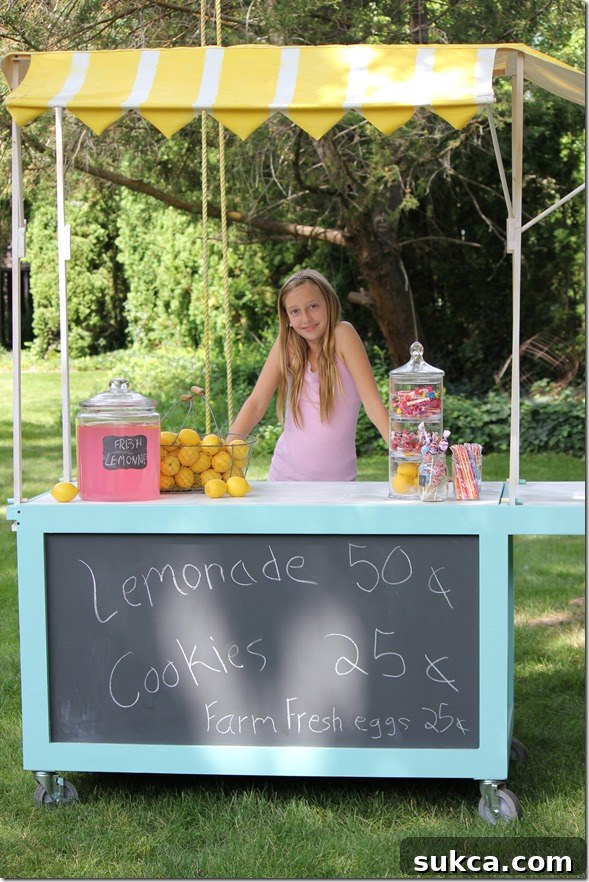 Lemonade cart with striped canopy Sophie's charming lemonade stand with a DIY spray-painted yellow and white striped canopy, offering shade and curb appeal.