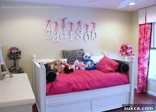 Cozy corner of a girl's bedroom, featuring a custom rose-covered lamp and other decorative elements, highlighting the room's soft and whimsical ambiance.