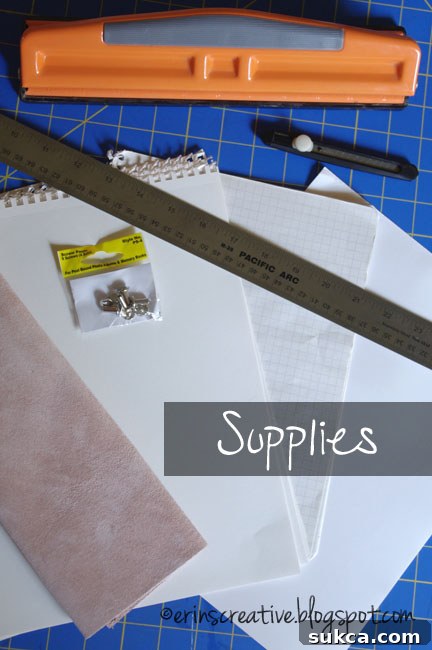 Leather Journal Supplies List Close-up of DIY leather journal supplies including leather sheet, paper, screw posts, and tools
