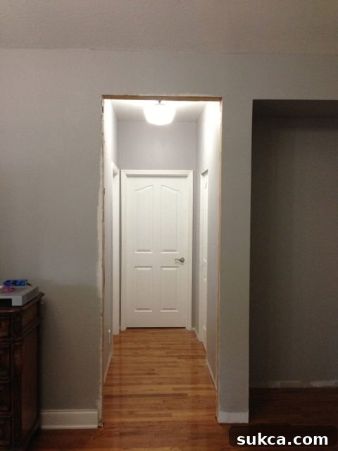 Hallway with new door and window casings being installed for a consistent look.