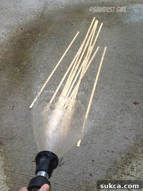 Wetting Wood for Bending Wetting wood strips with water to prepare them for bending