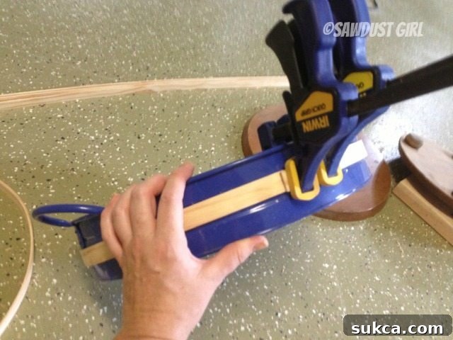 Shaping Wood Strips on a Circular Form Clamping wet wood strips around a circular form to dry and set their bend for decorative spheres