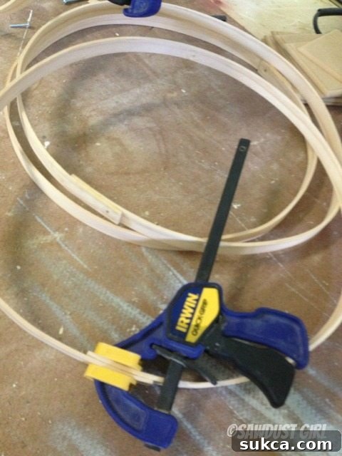 Gluing Wood Strips into Circles Gluing and clamping dried wood strips into sturdy circular rings for sphere construction