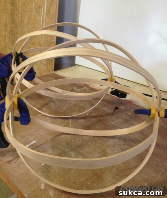 Assembling the Wood Sphere Assembling and gluing multiple wooden rings together to form a large decorative wood sphere