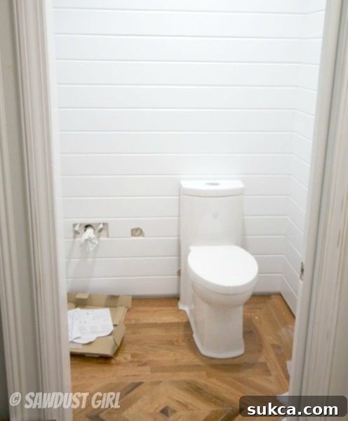 How to install a one-piece skirted toilet Installing a sleek one-piece, skirted toilet for easy cleaning and modern aesthetics in a DIY bathroom renovation.
