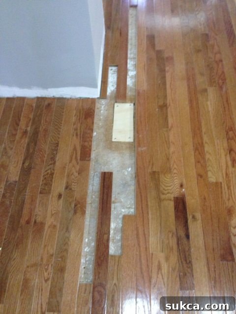 Meticulous Floor Patching to Cover Removed Vents and Ensure Smooth Subfloor