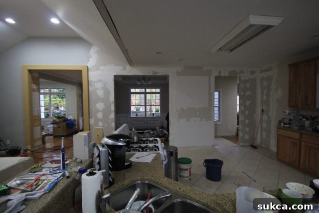 Transformed Kitchen Entrance Doorway and Current Renovation State