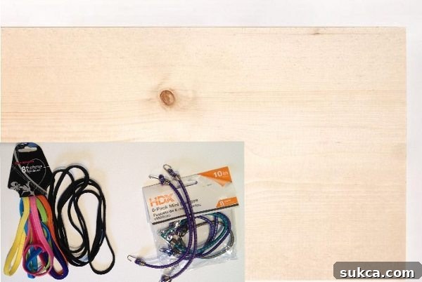 Materials for DIY Organizer Board, including pine wood, elastic straps, and hanging hardware