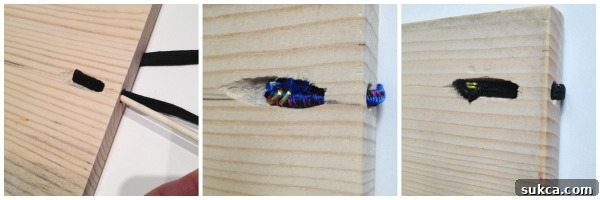 Close-up of staples securing elastic strap on the back of a DIY Organizer Board