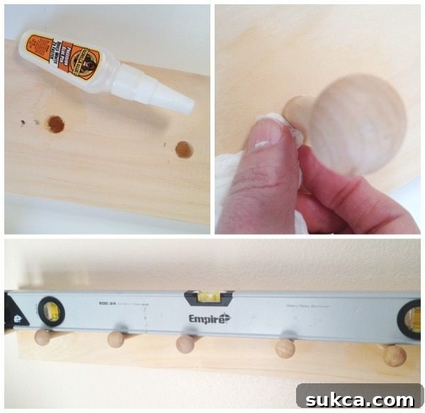 Adding Pegs to Shoe Organizer Boards Close-up of shaker pegs being inserted and glued into the pre-drilled holes on the wooden board, ensuring a snug and secure fit for the DIY shoe rack.