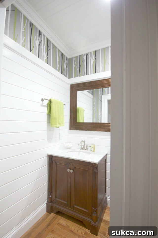 Close-up view of a luxurious bathroom vanity with solid hardwood construction and an elegant Italian marble top, featuring intricate details.