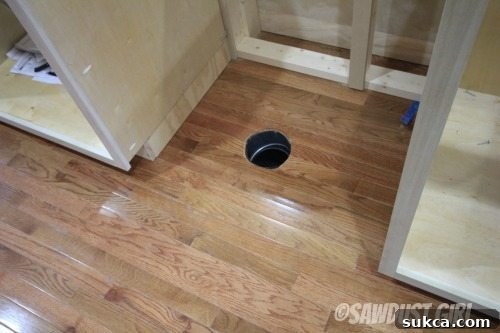 Kitchen island update showing new toe-kick vent installation