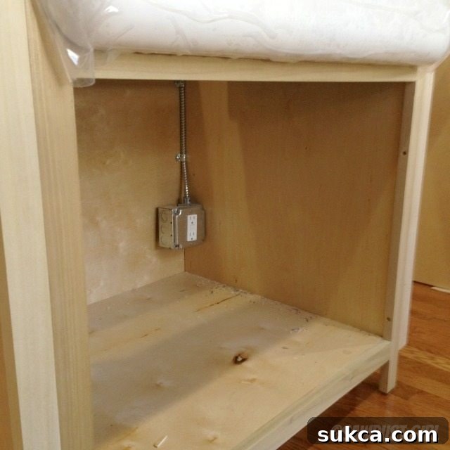 Apron sink cabinet ready for installation with electrical rough-in