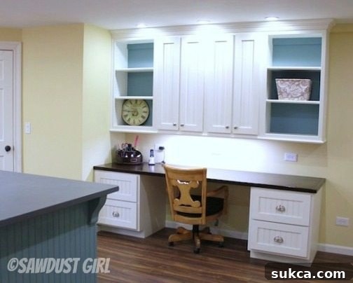Two large desk cabinets configured with recessed toekicks in a craft room, showcasing customization.