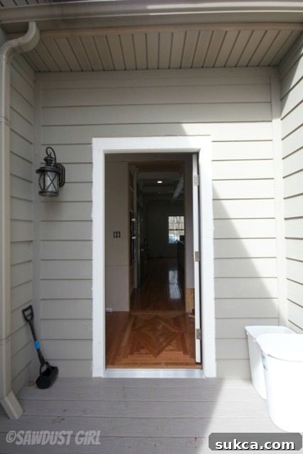 The final perspective of the new side entrance, highlighting its role as a seamless entry/exit point for the kitchen.