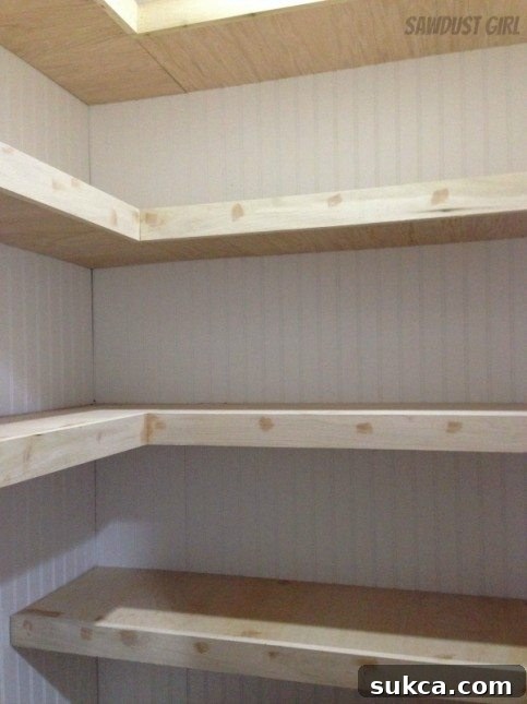 Hall closet with floating shelves