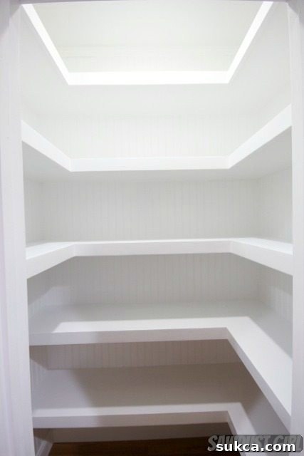 Hall closet with floating shelves