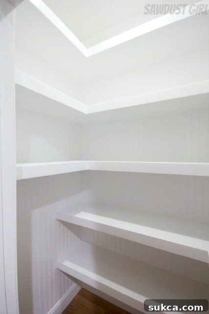 Hall closet with floating shelves