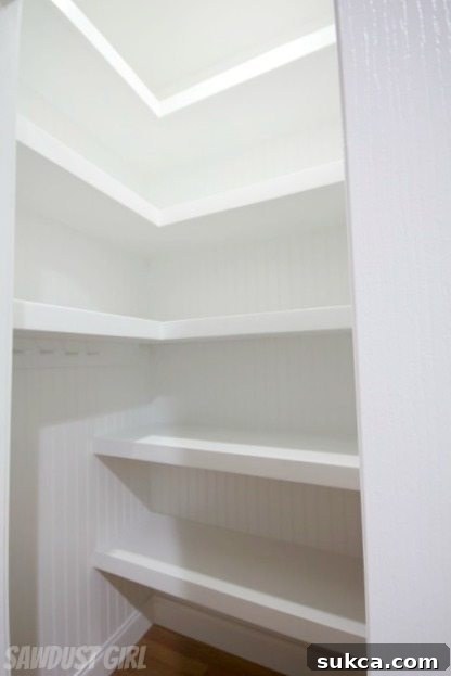 Hall closet with floating shelves