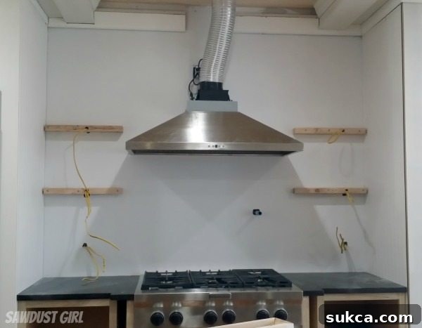 Installing tile backsplash: Finished section under the hood