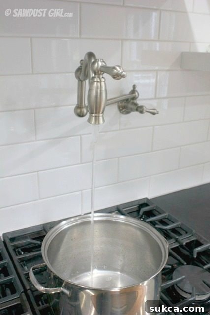 A glimpse of the blue pipe during rough-in, hinting at the future pot filler Kitchen Pot Filler