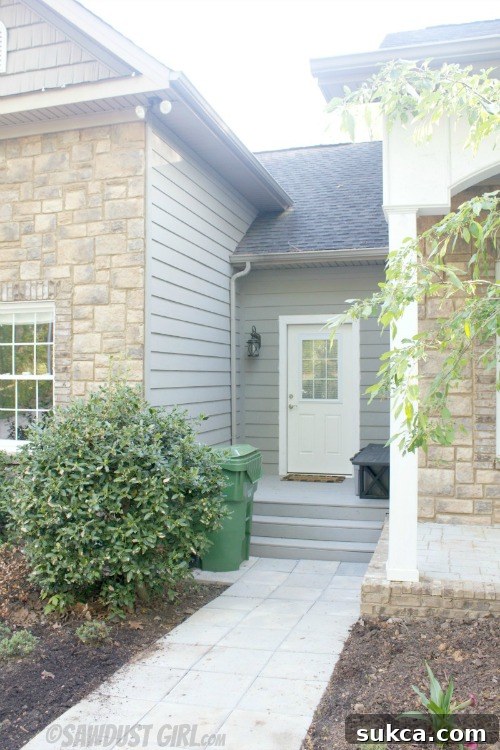 Overview of the clean and organized side entrance, showcasing the full transformation.