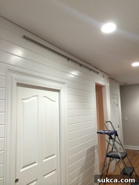 Completed barn door track installation