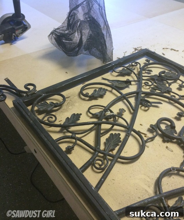 Cutting the Mesh Screen from a Repurposed Fireplace Insert