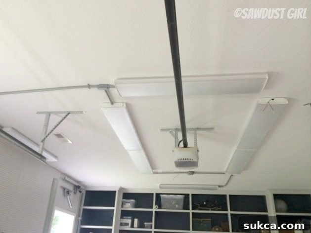 Electrical conduit and LED lights installed on workshop ceiling