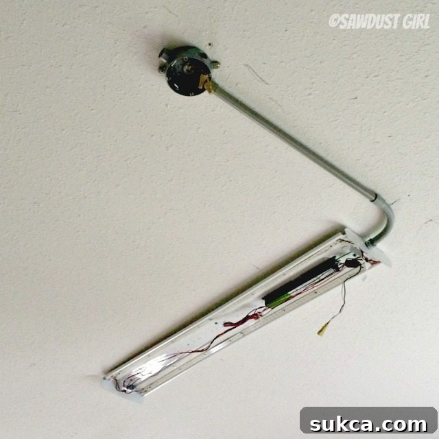 Junction box installed on the ceiling with wires pulled through