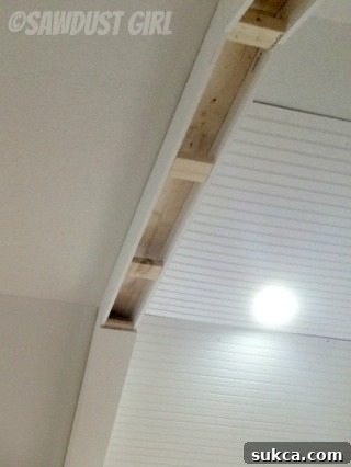 Internal Blocking for Beam Support Installation of internal 2x6 blocking within the box beams, essential for structural support and squareness