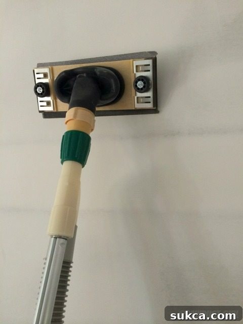 User-friendly dust-free drywall sander for cleaner home improvement Hyde Tools Dust-Free Drywall Sander in action, highlighting its ergonomic design