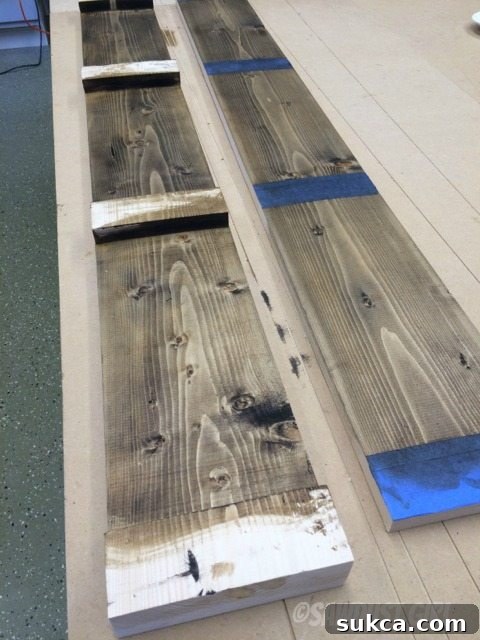 Applying Interior Finish Applying Briwax wood stain and finish to the interior surface of the magazine rack.