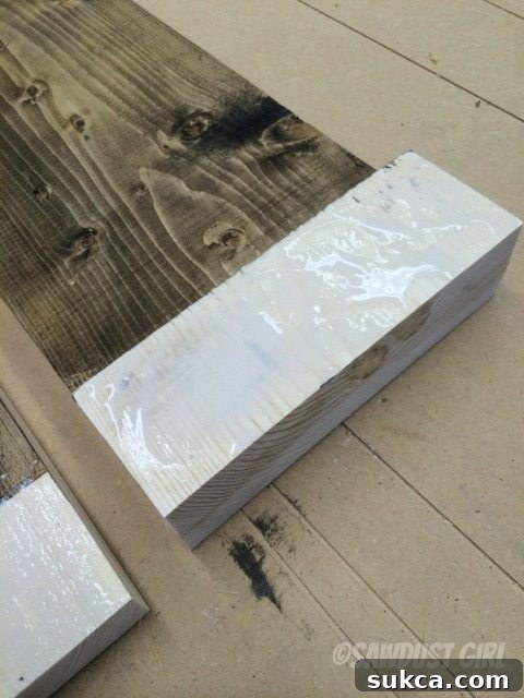 Final Gluing Stage Applying wood glue to the blocks before joining the two main panels of the magazine rack.